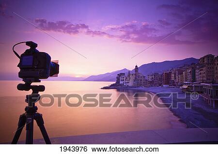 A Camera On A Tripod Pointing Towards The Buildings Along The Coast; Camogli Liguria Italy View Large Photo Image Stock Photograph - A Camera On A Tripod Pointing Towards The Buildings Along The Coast; Camogli Liguria Italy. Fotosearch