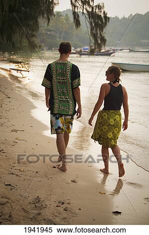 A Couple Walks On A Tropical Beach; Koh Tao Thailand View Large Photo Image Stock Photography - A Couple Walks On A Tropical Beach; Koh Tao Thailand. Fotosearch