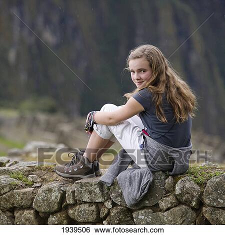 A Girl Sits On A Stone Wall In Machu Picchu; Peru View Large Photo Image Stock Photograph - A Girl Sits On A Stone Wall In Machu Picchu; Peru. Fotosearch