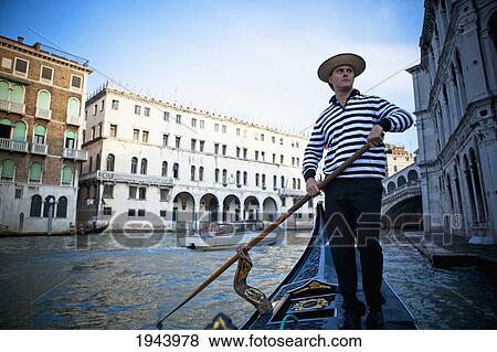 A Gondolier Rowing A Gondola; Venice Venezia Italy View Large Photo Image Stock Photo - A Gondolier Rowing A Gondola; Venice Venezia Italy. Fotosearch