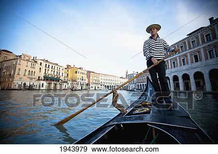A Gondolier Rowing A Gondola; Venice Venezia Italy View Large Photo Image Stock Photo - A Gondolier Rowing A Gondola; Venice Venezia Italy. Fotosearch