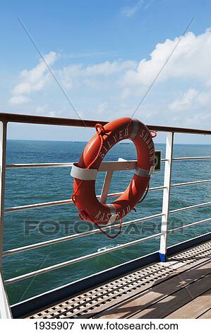 A Lifebuoy Hanging On The Railing Of The Silver Shadow Cruise Ship In The East China Sea; China View Large Photo Image Stock Photo - A Lifebuoy Hanging On The Railing Of The Silver Shadow Cruise Ship In The East China Sea; China. Fotosearch