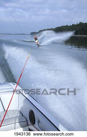 Stock Photograph - A Man Water Skiing Behind A Boat; Troutdale Oregon United States Of America. Fotosearch