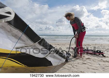 Stock Image - A Man With His Kite Surfing Equipment On Dos Mares Beach; Tarifa Cadiz Andalusia Spain. Fotosearch