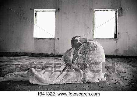 A Person Wrapped In A Blanket In An Empty Room; South Caicos Turks And Caicos Islands View Large Photo Image Stock Image - A Person Wrapped In A Blanket In An Empty Room; South Caicos Turks And Caicos Islands. Fotosearch