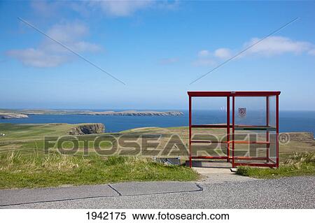 A Red Shelter On The Side Of The Road; Shetland Scotland View Large Photo Image Stock Photography - A Red Shelter On The Side Of The Road; Shetland Scotland. Fotosearch