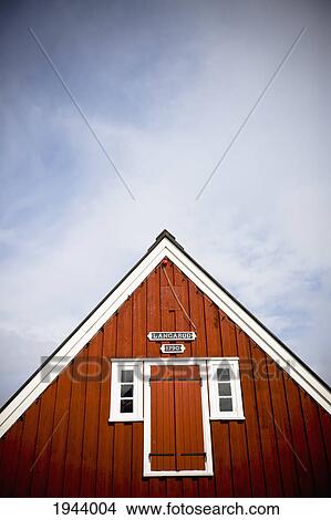 A Red Wooden Building With Shutters On The Window And A Peaked Rooftop; Papey Island Iceland View Large Photo Image Picture - A Red Wooden Building With Shutters On The Window And A Peaked Rooftop; Papey Island Iceland. Fotosearch