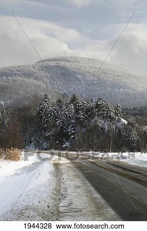 Stock Photo - a road in winter; orford quebec canada. Fotosearch