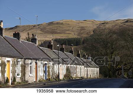Stock Photo - A Row Of Houses Along A Street; Straiton Dumfries Scotland. Fotosearch