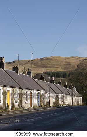 Stock Photo - A Row Of Houses Along A Street; Straiton Dumfries Scotland. Fotosearch