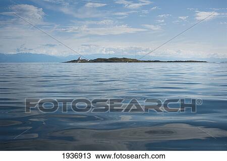 Stock Image - A Seascape And View Of Trial Island And Mountains; British Columbia Canada. Fotosearch