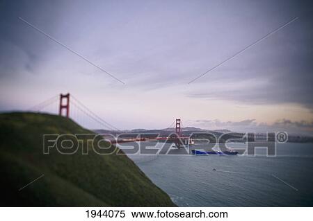 Stock Photography - A Ship And The Golden Gate Bridge In San Francisco Bay; San Francisco California United States Of America. Fotosearch