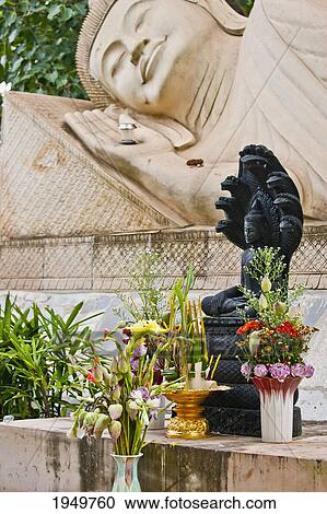 Stock Image - a shrine to a reclining buddha; cambodia. Fotosearch