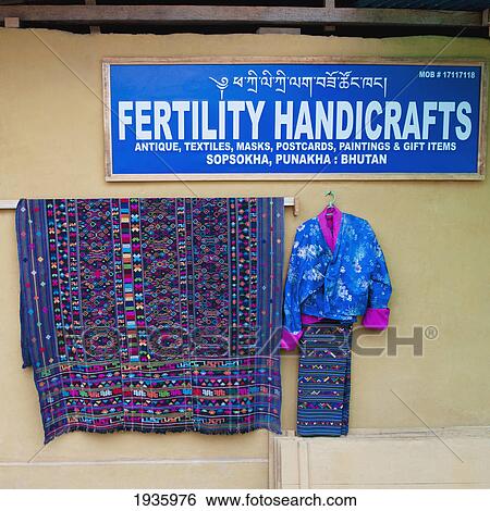 Stock Photograph - A Sign For Handicrafts And A Display Below; Punakha District Bhutan. Fotosearch