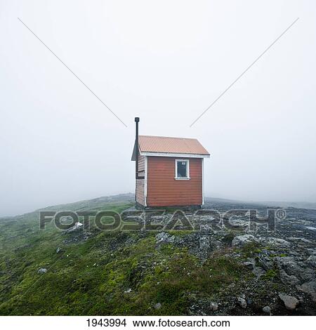 Picture - A Small Structure In The Middle Of A Wide Open Space Surrounded By Fog; Iceland. Fotosearch