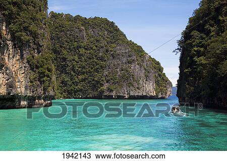 A Snorkeling Boat In The Island Waterway Near Koh Phi Phi; Phuket Thailand View Large Photo Image Stock Image - A Snorkeling Boat In The Island Waterway Near Koh Phi Phi; Phuket Thailand. Fotosearch
