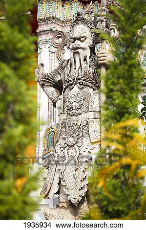 A Statue In Wat Pho, Temple Of The Reclining Buddha; Bangkok, Thailand View Large Photo Image Picture - A Statue In Wat Pho, Temple Of The Reclining Buddha; Bangkok, Thailand. Fotosearch