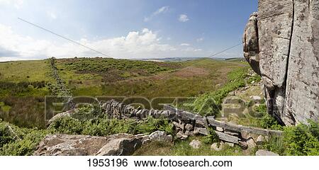 Stock Photograph - a stone wall leading across the landscape into the distance; northumberland england. Fotosearch