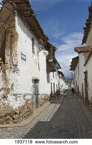 Stock Photo - A Street Running Through Rows Of Buildings; Cusco Peru. Fotosearch