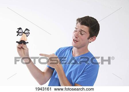 A Teenage Boy Pointing At A Groucho Marx Mask; Troutdale Oregon United States Of America View Large Photo Image Stock Image - A Teenage Boy Pointing At A Groucho Marx Mask; Troutdale Oregon United States Of America. Fotosearch