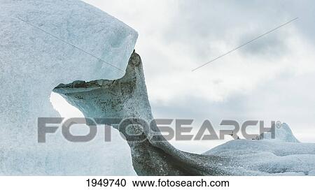 a unique ice formation forming an arch; iceland View Large Photo Image Stock Image - a unique ice formation forming an arch; iceland. Fotosearch