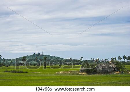 Stock Photography - a wat sits atop a hill in rural cambodia;. Fotosearch