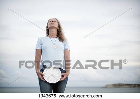 A Woman With A Biological Clock; South Caicos Turks And Caicos Islands View Large Photo Image Stock Photography - A Woman With A Biological Clock; South Caicos Turks And Caicos Islands. Fotosearch