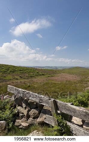 a wooden fence and a pile of rocks in a field; northumberland england View Large Photo Image Stock Image - a wooden fence and a pile of rocks in a field; northumberland england. Fotosearch