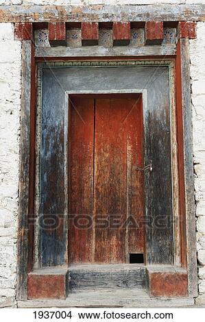 Picture - A Worn Out Red Wooden Door At Wangdichholing Palace; Bumthang District Bhutan. Fotosearch