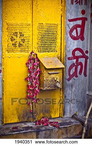 A Yellow Mailbox Is Draped With Red Flowers Were Left Over From A Puja; Inda View Large Photo Image Stock Image - A Yellow Mailbox Is Draped With Red Flowers Were Left Over From A Puja; Inda. Fotosearch