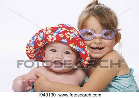 Stock Image - A Young Boy And Girl Wearing Goggles And Swim Wear; Troutdale Oregon United States Of America. Fotosearch