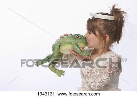 A Young Girl Wearing A Princess Dress And Kissing A Green Frog; Troutdale Oregon United States Of America View Large Photo Image Stock Image - A Young Girl Wearing A Princess Dress And Kissing A Green Frog; Troutdale Oregon United States Of America. Fotosearch
