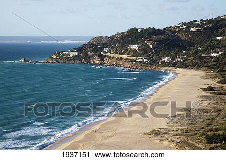 Stock Image - Beach Shoreline And Coastal Village; Zahara De Los Atunes Spain. Fotosearch