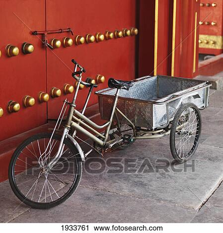Stock Image - Bicycle And Cart In Front Of The Xihe Gate Of The Forbidden City; Beijing, China. Fotosearch