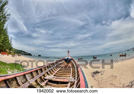 Stock Image - Boat On Nai Yang Beach; Phuket Thailand. Fotosearch