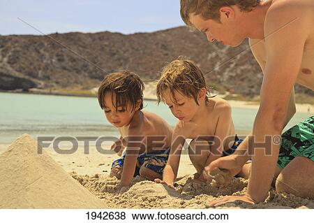 Boys Playing In The Sand In Los Islotes National Marine Park On Espiritu Santo Island; La Paz Baja California Sur Mexico View Large Photo Image Stock Photo - Boys Playing In The Sand In Los Islotes National Marine Park On Espiritu Santo Island; La Paz Baja California Sur Mexico. Fotosearch