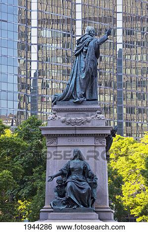 Stock Photograph - charity statue and the laurentian building; montreal quebec canada. Fotosearch