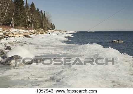 Stock Image - chunks of ice on the north shores of lake superior; grand portage minnesota united states of america. Fotosearch