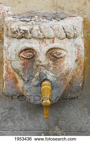 Stock Photograph - close-up of a head on the fountain in plaza de espana the main square; grazalema cadiz andalusia spain. Fotosearch