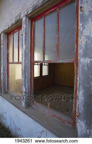 Stock Image - Dirty Windows At An Old Abandoned House; Burtonsville Alberta Canada. Fotosearch