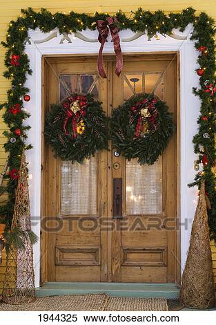 Stock Photography - doors of a house decorated for christmas; knowlton quebec canada. Fotosearch