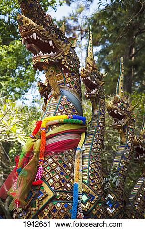 Stock Image - Dragons Guarding A Thai Buddhist Temple; Chiang Mai Thailand. Fotosearch