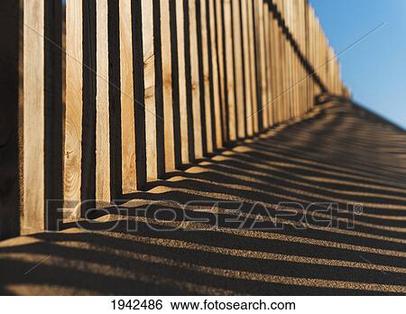 Stock Photograph - Fence Detail At Punta Paloma Sand Dunes; Tarifa Spain. Fotosearch