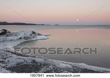 Stock Image - full moon on lake superior; grand portage minnesota united states of america. Fotosearch