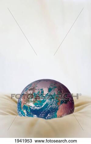 Stock Image - Globe Sitting On A Cushion. Fotosearch