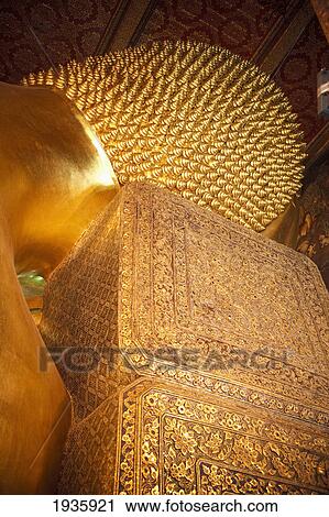Stock Image - Golden Buddha At Wat Pho, Temple Of The Reclining Buddha; Bangkok, Thailand. Fotosearch