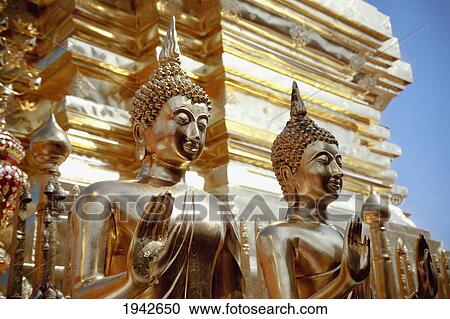 Stock Image - Golden Buddhas At Doi Suteph Temple; Chiang Mai Thailand. Fotosearch