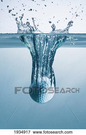 Stock Photo - Golf Ball Splashing Into Water. Fotosearch