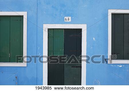 Green Wooden Shutters And Door On A Blue Painted Wall; Burano Venezia Italy View Large Photo Image Stock Photography - Green Wooden Shutters And Door On A Blue Painted Wall; Burano Venezia Italy. Fotosearch