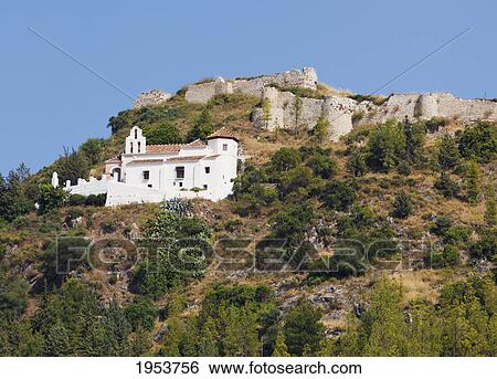 Stock Photograph - hermitage of our lady of the remedies and the castle; cartama malaga province spain. Fotosearch